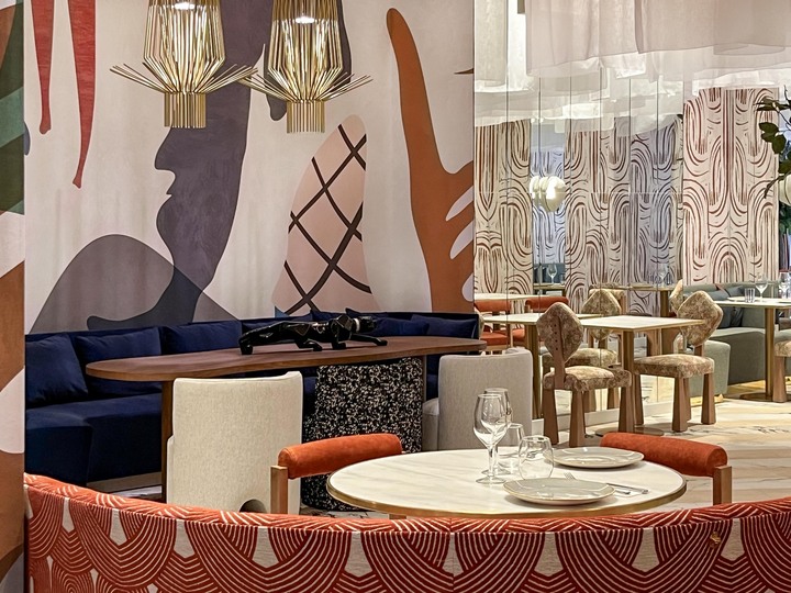 Dining room at Babou Restaurant. The image shows a table set for two.