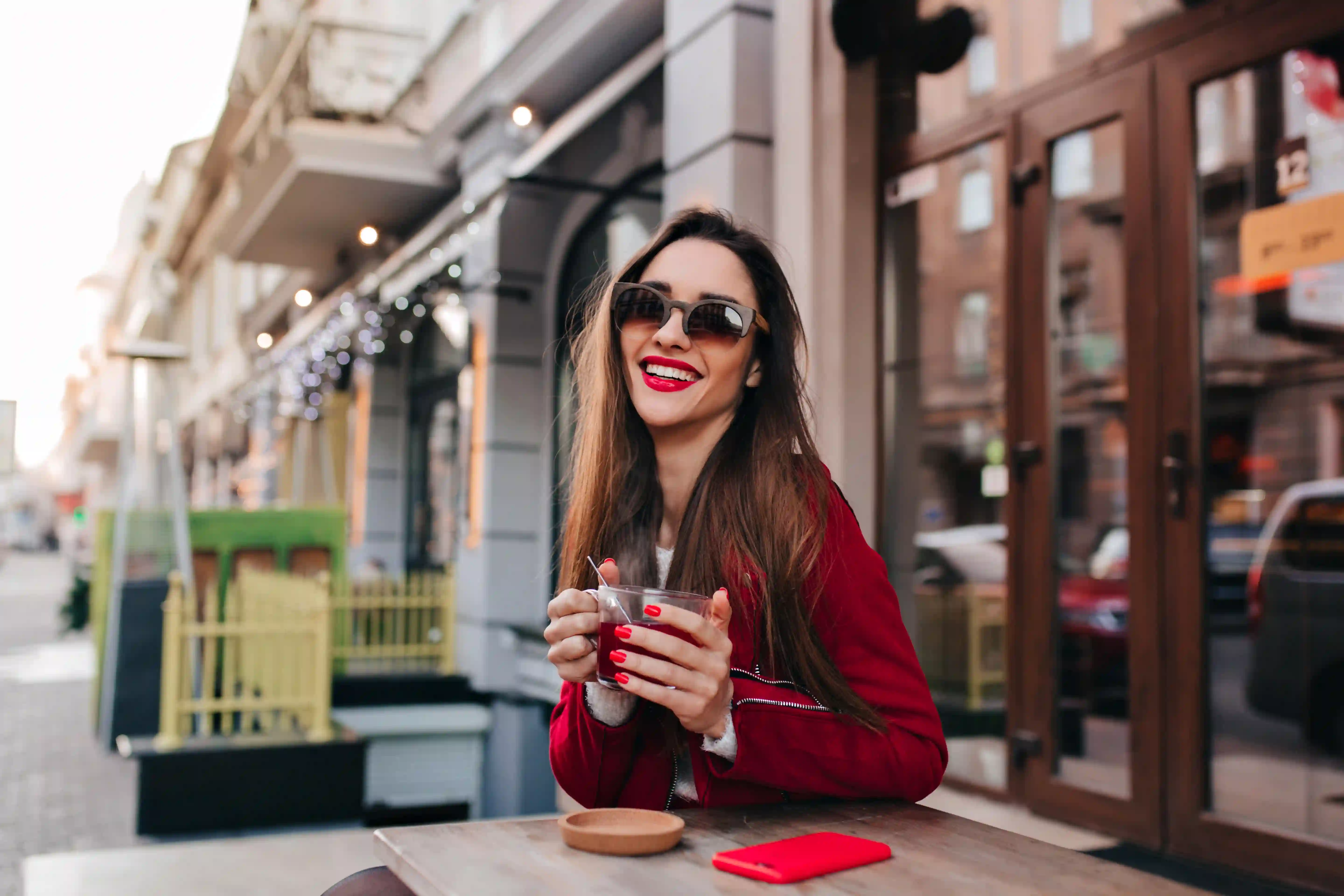 Woman drinking tea and smiling