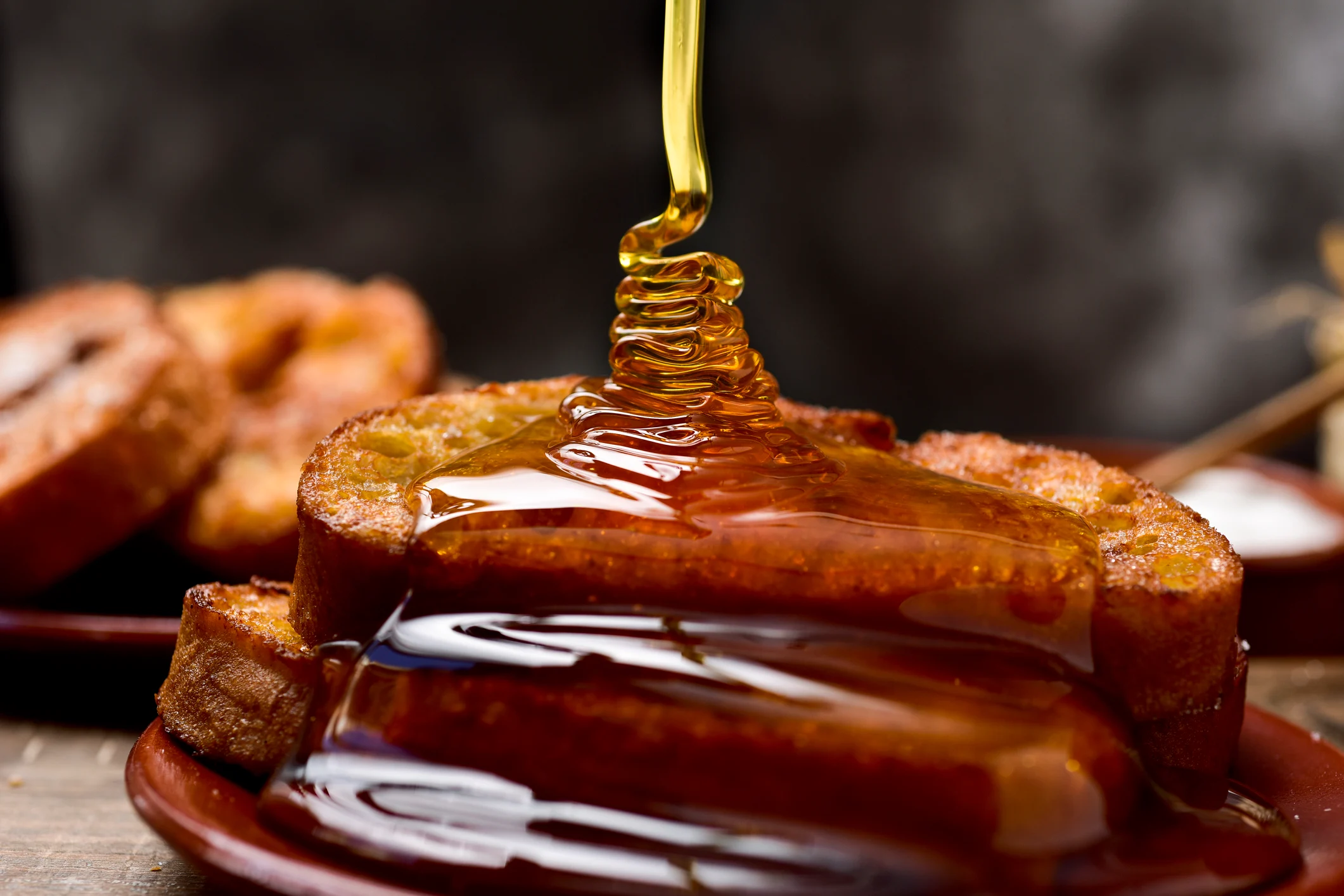 Torrijas with honey prepared at El Mirador restaurant in Seville